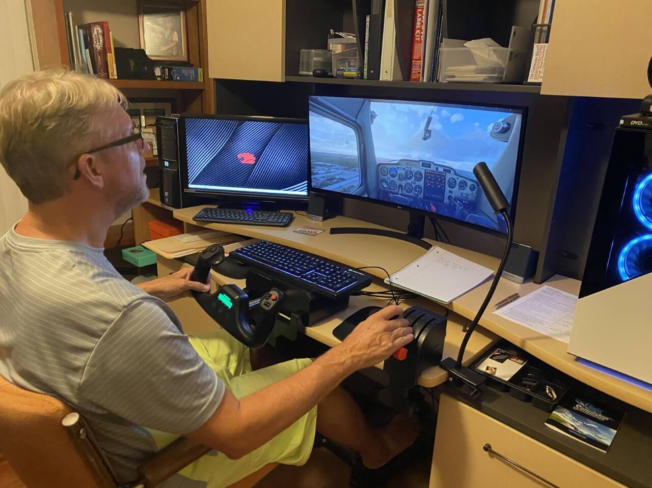 Older man at his computer playing Microsoft Flight Simulator